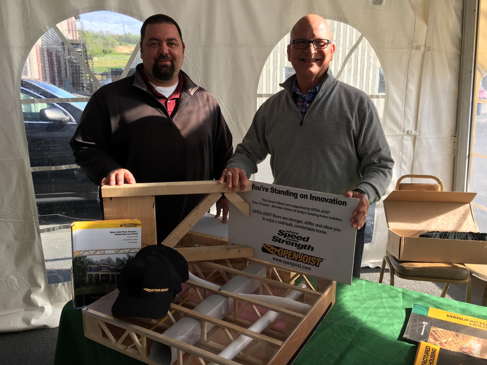 Open Joist salesmen at a trade show